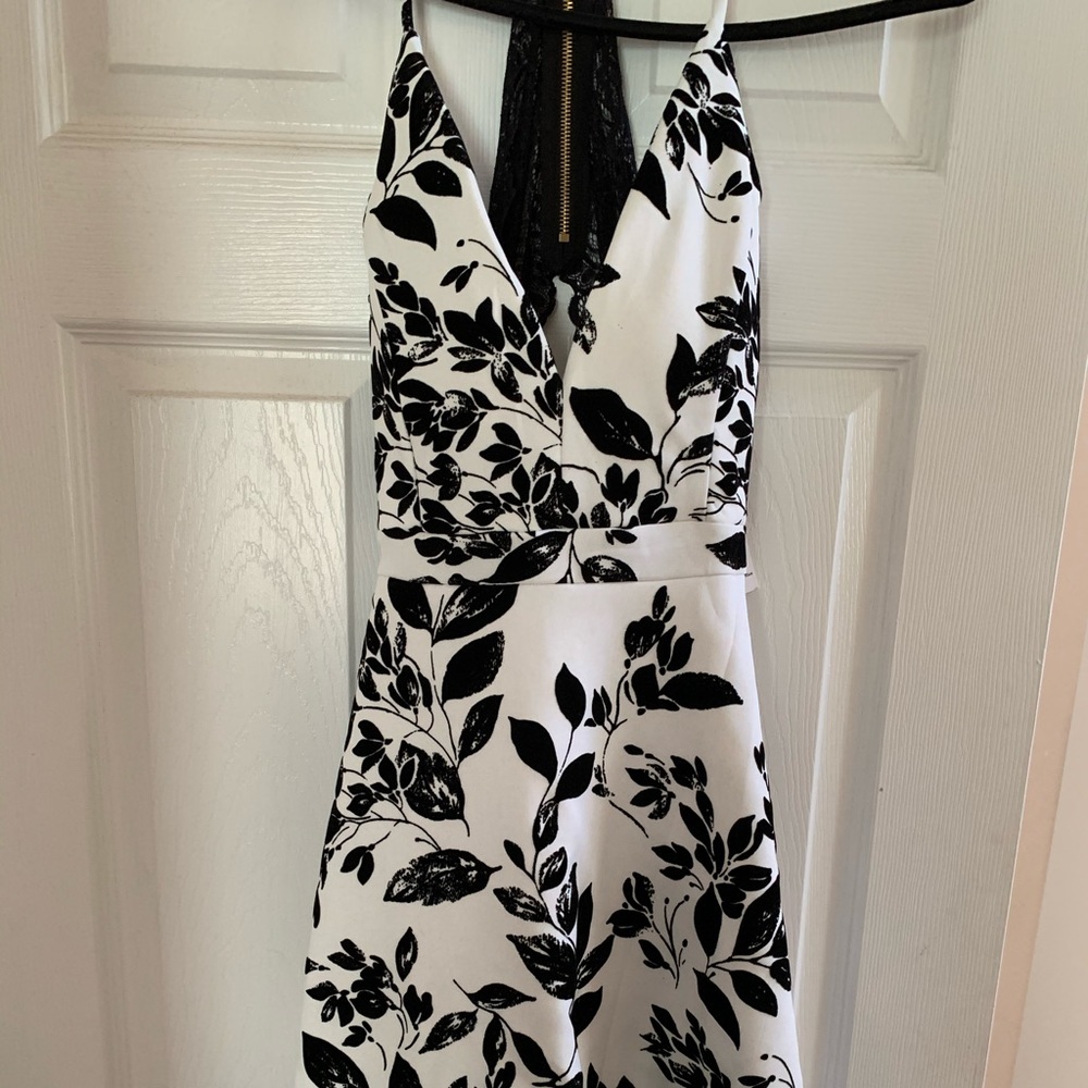 Black and white short dress with open lace back.